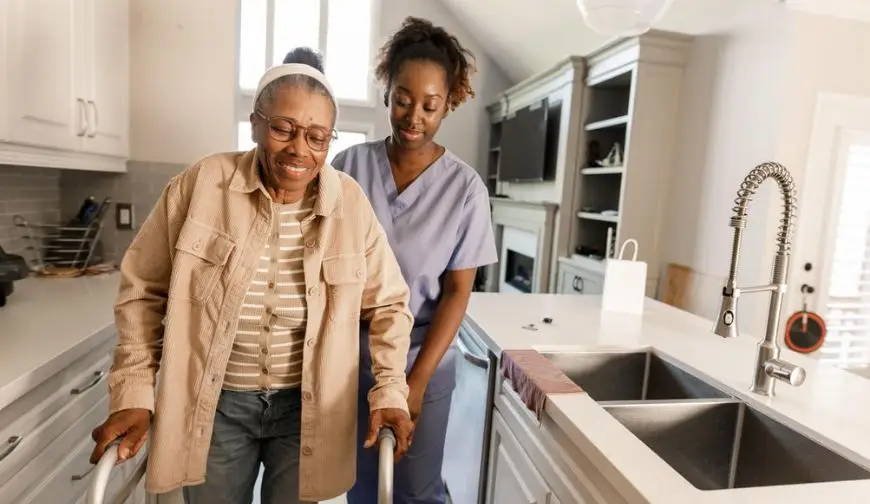 caregiver helping senior woman home safety inspection house
