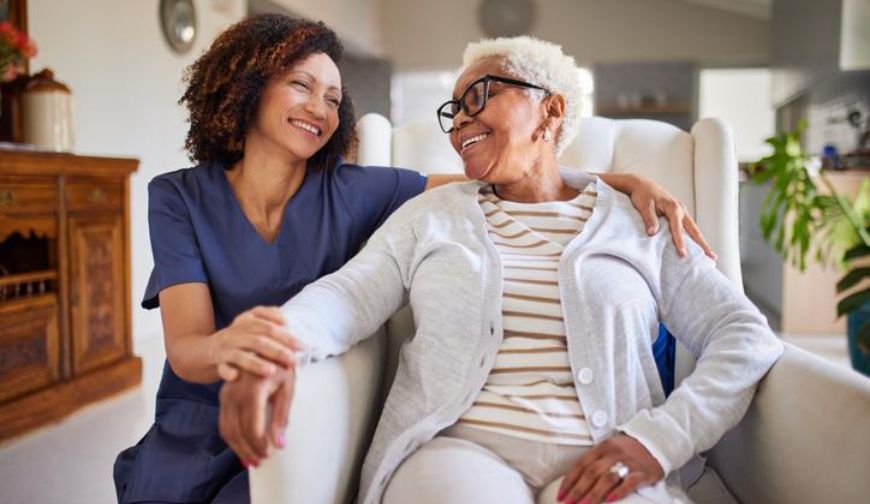 Caregiver providing companionship and support to a senior at home