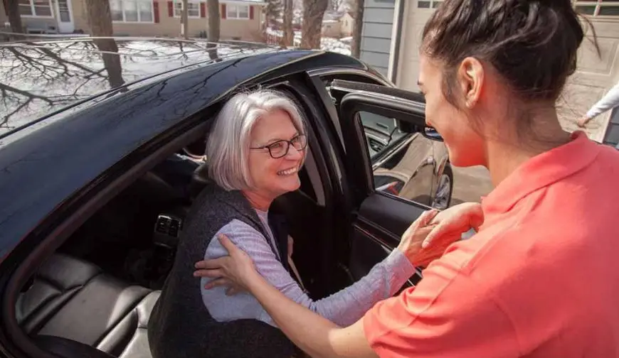 caregiver driving elderly woman to appointment Florida home care